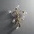Front view of an unlit Tree Branch Wall Sconce wall light, showing the detailed metal tree branch design and the texture of the five seeded glass shades.