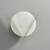 Front view of the unlit Disc Alabaster Wall Sconce wall light, showing how the metal frame uniquely supports the alabaster disc.