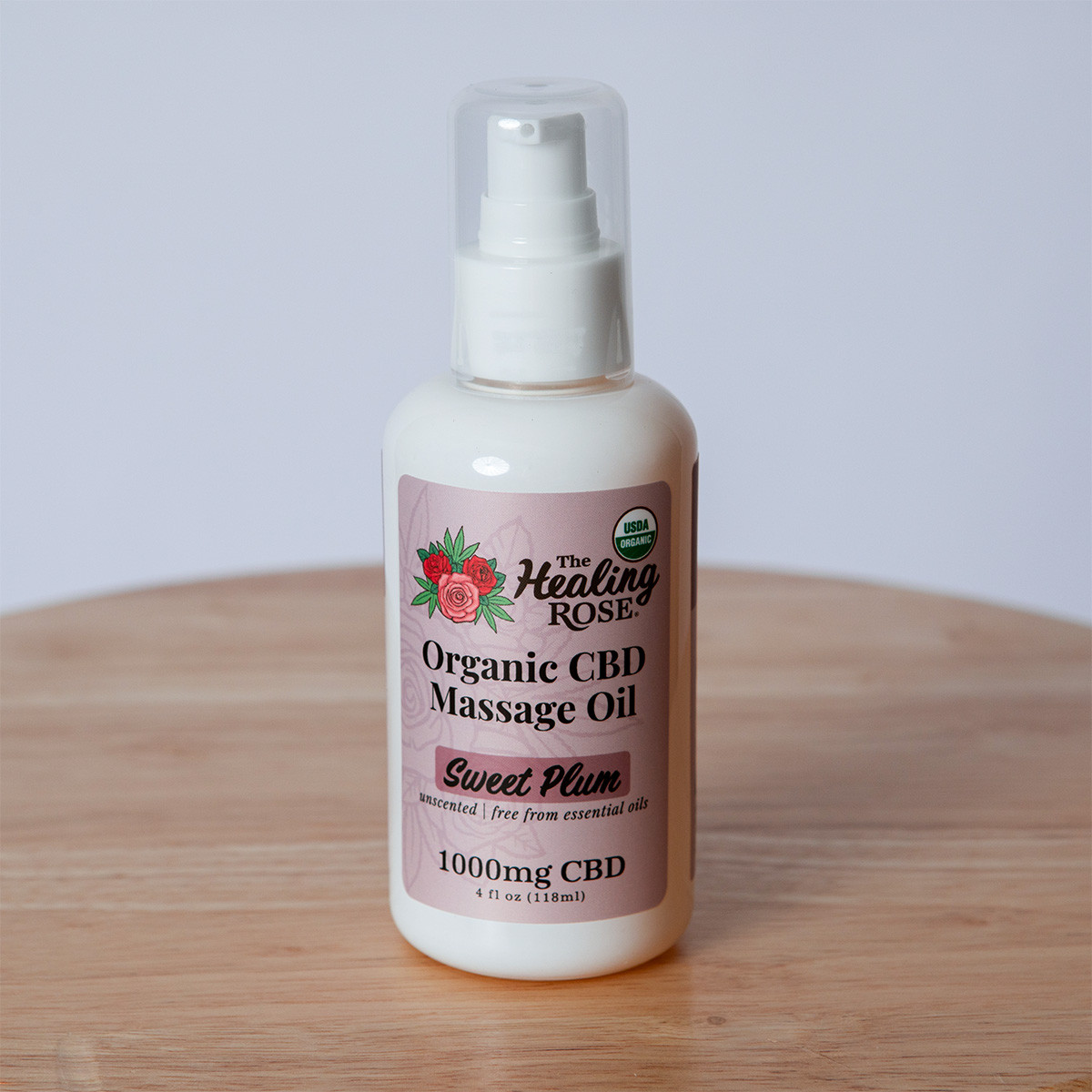 The Healing Rose Organic CBD Massage Oil in Sweet Plum, unscented and free from essential oils, 1000mg CBD, 4 fl oz pump bottle