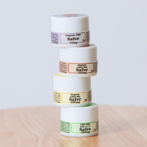 The Healing Rose Salve Flight Pack, with all 4 mini Salves stacked up