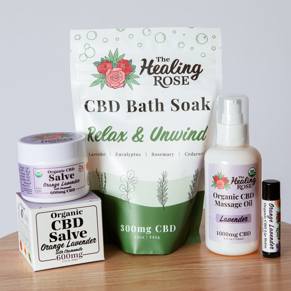 The Healing Rose Orange Lavender CBD bundle with Relax & Unwind bath soak, Orange Lavender salve, Lavender massage oil, and Orange Lavender lip balm