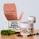 The Healing Rose Peppermint Spice Organic CBD CBG Salve in large and small jars beside clove buds and fresh peppermint leaves