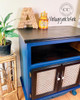 Dixie Belle Paint Bunker Hill Blue Chalk Mineral Paint is the perfect paint for any DIY project!
Cabinet painted in Bunker Hill Blue Chalk Mineral Paint with No pain Gel stain in black for the top, cubby hole and along the cane doors.
