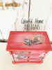 Belles and Whistles Boho Soul - Rub On Furniture Transfer, Best Transfers for Furniture.
Here we are looking down on a red, painted side table.  It has Boho Soul transfer on the top and front.  There are brass knobs on the drawers.  it is in front of a wooden, planked wall and there are the words that say, "Colorful Home DESIGNS" super imposed on the picture.