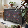 Belles and Whistles Latin Floral - Rub On Furniture Transfer, Best Transfers for Furniture Makeovers!
A brown chest with the front panel covered in Latin Floral Transfer staged with potted plants around the furniture and a stack of books with a potted plant on top of the piece.