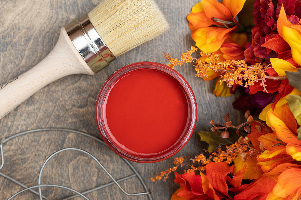 Premium Photo  Red paint brushes in a metal can on a table with