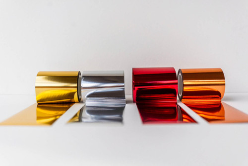 Four rolls of Dixie Shine, of each color. From left to right: gold, silver, red, and copper.