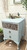 Belles and Whistles Art Deco Bird Pattern - A1 Rice Decoupage Paper 
This is a bulky, light blue night stand.  The top drawer has Art Deco Bird Pattern Rice Decoupage on the front of it.  The middle and bottom drawers are just painted in the same light blue paint.  There is a branch with leaves and pink flowers on top of the night stand.  The night stand is in front of two, paneled doors.  There is a green picture frame hanging above the night stand.  To the right of the picture frame are some leaves that go out of frame and to the left of the picture frame is some twine hanging down.