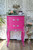 Prickly Pear Silk All-In-One paint is perfect for painting kitchen cabinets, bathroom cabinets and painting furniture. Pink chalk painted end table with silver painted on the trim and hardware. Staged with florals and the paint jars on top.