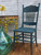 Blue Agave Terra Clay Paint provides endless possibilities for your imagination and can be used on wood, canvas, tile, fabric and more! Vintage wooden chair painted in Blue agave Terra Clay Paint with distressed accent. Staged in front of a white brick wall next to yellow hallway table and empty blue glass vase.