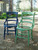 Dixie Belle Paint Kudzu Chalk Mineral Paint is the perfect paint for any DIY project!
Two vintage chairs one painting in Kudzu Chalk Mineral Paint and the other painted in Bunker Hill Blue CMP staged outside on a dirt driveway.