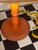 Dixie Belle Paint Terracotta Chalk Mineral Paint closed up of the leg of the dresser with bananas on the ground to the right of it.