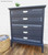 Belles and Whistles Patterns - Silkscreen Stencil provides an extra decorative touch to any project! Dark Blue chalk painted dresser with white hardware and Patterns stencil painted on.