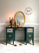 Midnight Green Silk All-In-One paint is perfect for painting kitchen cabinets, bathroom cabinets and painting furniture. Dark green Silk all in one painted desk with cheetah print and black and white stripes on the drawers. Staged with a gold mirror, some candle sticks and buddha heads.