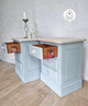 Serenity Silk All-In-One paint is perfect for painting kitchen cabinets, bathroom cabinets and painting furniture! Twin bedside tables painted in serenity with a light wooden top and a transfer on the side of the drawers.