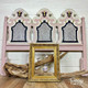 Belles and Whistles Greek Key - Stencil provides an extra decorative touch to any project! Pink headboard with white woodwork and gold with black accents on inner woodwork. Contains Greek Key - Stencil in center pieces of furniture. Staged with an empty gold frame a large driftwood branch and three pink teapot set in the center of said frame.