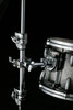 Image of Pearl universal clamp mounted on stand holding a tom