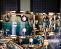 Toms DW Collector's 4pc Kit - Exotic Dirty Fish Tank Fade over Olive Ash Burl 333 Maple Shells