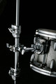 Image of Pearl universal clamp mounted on stand holding a tom
