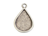 Fall in love with the elegant look of this Nunn Design pendant. This pendant features a bezel frame with an elegant teardrop shape. It's perfect for showcasing custom designs. Fill the frame with epoxy clay, use resin to add personal touches, or try other mixed media elements. The loop at the top of the pendant makes it easy to add to designs. Try it at the center of a necklace or even in bold earrings. It features a versatile silver shine. Hole Size 3.5mm, Length 36mm, Width 22.5mm