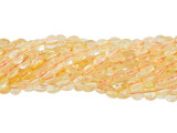Add gleaming accents to designs with these Dakota Stones beads. These small gemstone beads feature a circular shape with a puffed edge and a diamond-cut faceted face. The surface catches the light in a multitude of directions. Use these small beads as accents of color and shine in all kinds of jewelry projects. They feature a buttery golden-yellow color. Metaphysical Properties: Citrine is said to be a stone of creativity. Because gemstones are natural materials, appearances may vary from piece to piece. Each strand includes approximately 100 beads.