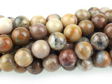 Bring natural color to your designs with the Dakota Stones 6mm Venus Jasper round beads. These beads are perfectly round in shape, so you can use them with any style. They are versatile in size, so you can use them in necklaces, bracelets and even earrings. These gemstone beads feature warm, earthy tones like beige, peach, brown and gray. They are sure to add soothing style to your designs. Venus Jasper takes its name from the planet Venus, which was named for the Roman goddess of love and beauty. It is also referred to as orbicular rhyolite. Metaphysical Properties: Jasper is a stone used from grounding, stability, strength and healing.Because gemstones are natural materials, appearances may vary from piece to piece. Each strand includes approximately 34 beads. 