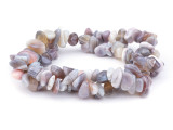 Decorate your jewelry designs with the gemstone style of these Dakota Stones beads. Botswana Agate displays highly defined parallel banding, usually in white on hues of brown, gray, pink, tan, apricot and purplish red. Botswana Agate was formed nearly 187 million years ago by lava flowing in waves from long faults in the earth. This lava rolled across the landscape, depositing layer upon layer of Quartz silicate to create the banding and patterns now prized in Botswana Agate. Because gemstones are natural materials, appearances may vary from bead to bead.