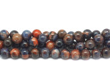Add bold colors to your designs with this Dakota Stones dyed orange sodalite 8mm round bead strand. These beads feature a mix of bold blue and vibrant orange tones. They feature a classic round shape that is easy to add to your designs. Orange Sodalite has veins of orange, white and gray within the primarily bright to deep blue or black stone. Sodalite is named for its sodium content. Because gemstones are natural materials, appearances may vary from piece to piece.