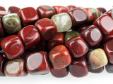 Contemporary style meets rich color in the Dakota Stones 7mm Apple Jasper cube beads. These beads feature a modern cube shape that is sure to stand out in designs. Add them to contemporary styles for a splash of color. They are versatile in size, so they will work in necklaces, bracelets and earrings. These beads feature the rich and juicy colors of fresh apples hanging from a tree. Deep red mingles with hints of leafy green and bark brown. Pair them with earthy colors for a pleasing display. Jasper is an opaque variety of quartz, with a microscopic crystalline structure. Metaphysical Properties: Jasper is thought to improve vision and protect from unseen dangers at night.Because gemstones are natural materials, appearances may vary from piece to piece. Each strand includes approximately 28 beads.Length 7-8mm, Width 7-7.5mm