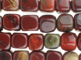 Contemporary style meets rich color in the Dakota Stones 7mm Apple Jasper cube beads. These beads feature a modern cube shape that is sure to stand out in designs. Add them to contemporary styles for a splash of color. They are versatile in size, so they will work in necklaces, bracelets and earrings. These beads feature the rich and juicy colors of fresh apples hanging from a tree. Deep red mingles with hints of leafy green and bark brown. Pair them with earthy colors for a pleasing display. Jasper is an opaque variety of quartz, with a microscopic crystalline structure. Metaphysical Properties: Jasper is thought to improve vision and protect from unseen dangers at night.Because gemstones are natural materials, appearances may vary from piece to piece. Each strand includes approximately 28 beads.Length 7-8mm, Width 7-7.5mm