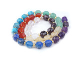 Energize your designs with this Dakota Stones chakra stones faceted 8mm energy prism bead strand. The beads on this strand feature a faceted cut helping them catch the light. This strand features spacers between each of the beads, so you could use it as-is, or string the beads into a design. This strand contains 8 different varieties of gemstones representing the different Chakras. The included gemstones are Amethyst, Lapis, Blue Apatite, Green Aventurine, Citrine, Carnelian, Red Garnet and Crystal Quartz.  Because gemstones are natural materials, appearances may vary from bead to bead.