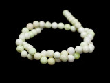 Bring the beauty of gemstones to your designs with these 6mm round beads from Dakota Stones. These beads feature a classic round shape. Chrysoprase is a bright apple green, translucent stone, whose color often caused ancient jewelers to confuse it with Emerald. A cryptocrystalline Chalcedony, its brilliant color comes from the presence of very small inclusions of Nickel compounds. Chrysoprase is believed to balance the heart chakra and help one understand their needs and emotions. Because gemstones are natural materials, appearances may vary from bead to bead.