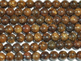 Give your designs a rich display of color with the bronzite 8mm large-hole round beads from Dakota Stones. Available by the strand, these gemstone beads will amaze and delight with their innovative design. Each bead features a wide stringing hole, perfect for using with thicker stringing materials like leather cord. In fact, these beads are temporarily strung on leather cord. These perfectly round beads feature hypnotizing swirls of chocolate brown, bronze and gold. Bronzite is a stone belonging to the orthoproxene group of minerals. The bronze-like metallic luster is caused by the iron content in the material. Metaphysical Properties: The energy of bronzite promotes certainty and control and it encourages us to take control over our own actions.Because gemstones are natural materials, appearances may vary from piece to piece. Each strand includes approximately 24 beads. 