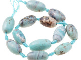 A beautiful blend of earthly color fills these terra agate beads from Dakota Stones. These beads feature a mix of greenish-blue and brown, creating patterns like a map with the brown spaces like continents in the vast ocean. Terra agate is a form of chalcedony made of quartz. These beads are treated and dyed agate. Because gemstones are natural materials, appearances may vary from piece to piece.