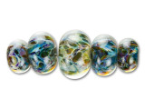 Add a universe of color to your designs with the Grace Lampwork multi-color swirled graduated roundel bead strand. This strand features bold roundel beads in graduated sizes. Use them together in a necklace or bracelet design with other beautiful beads. The glass contains swirling beauty in different colors like purple, blue, yellow, green and brown.This item is handmade, so appearances may vary.Beads range in size from 13 x 8mm to 19 x 12mm