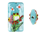Create lively style with this Grace Lampwork bead. This bead features a rectangular shape and a puffed dimension that will stand out in your jewelry designs. Both sides are decorated with a bright green tree frog staring with red eyes. The frog sits on a green branch surrounded by sweet pink and white flowers on a soft blue background. String this bead onto a head pin for a quick pendant, use it at the center of a bold bracelet style, and more. It will add cheerful beauty anywhere.This item is handmade, so appearances may vary.38.0 x 20.0mm