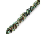 African turquoise is a descriptive name: it is not true turquoise, but actually a jasper found in Africa. These semiprecious beads have a matrix structure similar to that of turquoise, and are light bluish-green in color.The matrix in African turquoise is usually dark or black, and African turquoise beads provide a good substitute for genuine turquoise beads. As with many semiprecious gemstones, identifying a stone accurately can be tricky!African turquoise looks very similar to variquoise, a unique combination of variscite and turquoise found in Utah and Nevada.  Please see the Related Products links below for similar items, and more information about this stone.