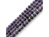 Lepidolite beads are cut from an uncommon mica that has been inconsistently available in the mineral market. Also known as gem lepidolite, lavenderine, and lepidolite mica, this semiprecious gemstone is a by-product of mining lithium. Unpolished lepidolite appears scaly, and its name derives from the Greek word lepidos, which translates to "scale." The color in these semiprecious beads ranges from violet to pale pink or white (or, occasionally, gray or yellow). Lepidolite beads can contain black markings which further add to their visual appeal. This gemstone is purported to have a calming effect, relieve muscle pain, relax nerves, and connect the heart and crown to bring spiritual understanding of pain and suffering. Lepidolite is also said to help people meet the challenges of change in their lives! Lepidolite rough is found in Zimbabwe, Sweden, Argentina, Canada (Quebec), Madagasgar, Russia, and the U.S.A. (California and Maine).   See the Related Products links below for similar items, and more information about this stone.