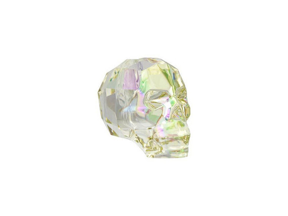 Add bold enchantment to your designs with the PRESTIGE Crystal Components 5750 13mm skull bead in Crystal Luminous Green. Crystal gets an edgy and expressive spin in this unique skull bead. This darkly glamorous element is a masterpiece full of precision-cut facets. This statement piece will add rebellious energy to your designs and works well with spikes. This sparkling reminder to live life to the fullest is a powerful and intriguing bead that will mark you as a trend-setter. This bead features a mixture of pale green and pink color with hints of pale gold.
