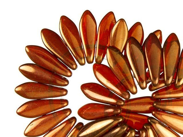 Warm beauty is on display in the CzechMates glass 16 x 5mm sunset maple two-hole dagger beads. These beads feature a dagger shape with two stringing holes at the top of the bead. They can dangle from designs or stand out in seed bead embroidery. The two stringing holes even allow you to add them to multi-strand looks. You will have even more design possibilities when you use these beads in your projects. They feature topaz orange color with a golden gleam. 