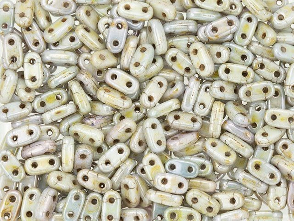Create dimensional beaded designs with these CzechMates Bar Beads. These flat, oval bar-shaped beads each feature two stringing holes running through them. They are perfect for using with other CzechMates beads, as the stringing holes line up perfectly. Stack and layer them in designs, add them to multi-strand projects, use them in bead embroidery, and more. There are so many possibilities for these little beads. 