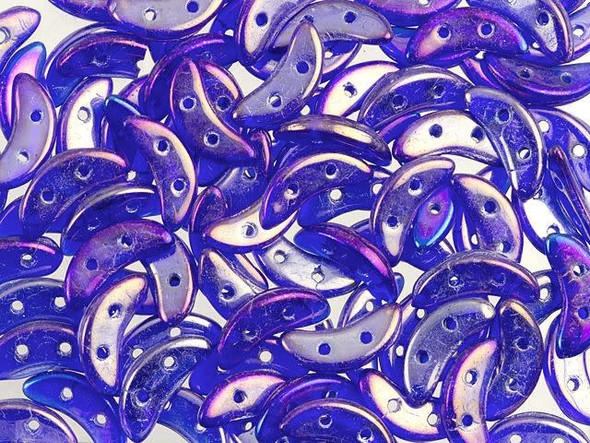 For a magical display in your designs, try the CzechMates glass 4x10mm cobalt Iris luster 2-hole crescent beads. These flat beads feature a crescent shape, like a moon. Two stringing holes run through the center of the shape, so you can add it to designs in unique ways. Layer them with other beads in bead weaving projects or use them to add dimension to stringing projects. They would make interesting elements in bead embroidery. These beads feature deep blue color with a subtle gold and purple gleam. 