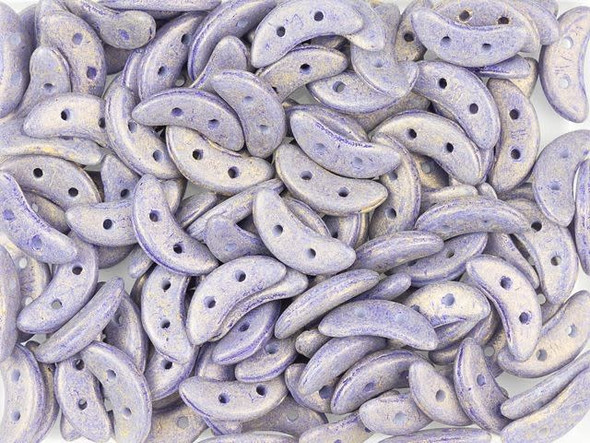 For unique dimension in your beading projects, try the CzechMates Crescent Beads. These flat beads feature a crescent shape, like a moon. Two stringing holes run through the center of the shape, so you can add it to designs in innovative ways. Layer it with other beads in bead weaving or use it to add dimension to stringing projects. It would make an interesting element in bead embroidery, too. These beads feature a berry blue color with a subtle golden sheen. 