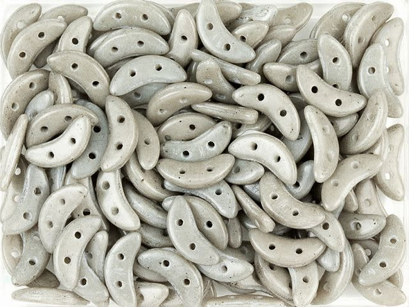 For unique dimension in your beading projects, try the CzechMates Crescent Beads. These flat beads feature a crescent shape, like a moon. Two stringing holes run through the center of the shape, so you can add it to designs in innovative ways. Layer it with other beads in bead weaving or use it to add dimension to stringing projects. It would make an interesting element in bead embroidery, too. These beads feature pale gray color. 