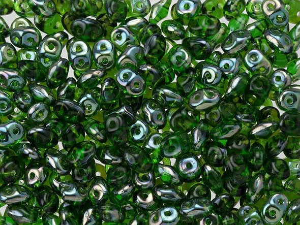 Deep green color gleams with ethereal metallic tones in these Matubo SuperDuo beads. Create intricate jewelry designs with Czech glass seed beads! Featuring a unique shape and two stringing holes, these seed beads add a special touch of creativity to your designs. They have tapered edges and nest up nicely when strung, making them ideal for floral and woven designs. Add a special touch to your jewelry with Czech glass seed beads!  