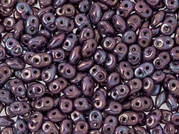 Regal purple tones shine majestically in these Matubo SuperDuo beads. Create intricate jewelry designs with Czech glass seed beads! Featuring a unique shape and two stringing holes, these seed beads add a special touch of creativity to your designs. They have tapered edges and nest up nicely when strung, making them ideal for floral and woven designs. Add a special touch to your jewelry with Czech glass seed beads!  