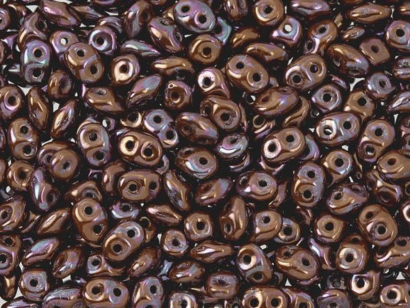 Gleaming terracotta color combines with a metallic purple shine in these Matubo SuperDuo beads. Create intricate jewelry designs with Czech glass seed beads! Featuring a unique shape and two stringing holes, these seed beads add a special touch of creativity to your designs. They have tapered edges and nest up nicely when strung, making them ideal for floral and woven designs. Add a special touch to your jewelry with Czech glass seed beads!  