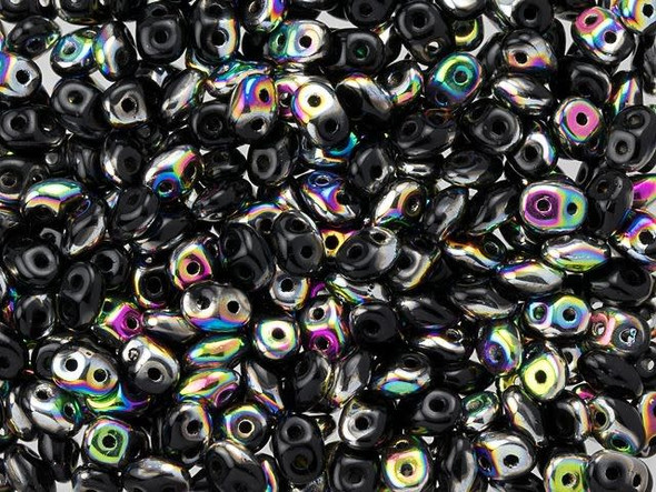 bold black color combines with iridescent rainbow colors in these Matubo SuperDuo beads. Create intricate jewelry designs with Czech glass seed beads! Featuring a unique shape and two stringing holes, these seed beads add a special touch of creativity to your designs. They have tapered edges and nest up nicely when strung, making them ideal for floral and woven designs. Add a special touch to your jewelry with Czech glass seed beads!  