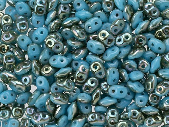 Turquoise blue color combines with shining metallic tones in these Matubo SuperDuo beads. Create intricate jewelry designs with Czech glass seed beads! Featuring a unique shape and two stringing holes, these seed beads add a special touch of creativity to your designs. They have tapered edges and nest up nicely when strung, making them ideal for floral and woven designs. Add a special touch to your jewelry with Czech glass seed beads!  