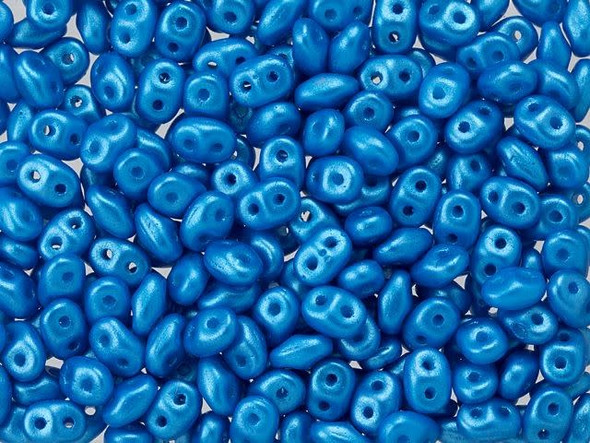 Deep blue color with a pearlescent sheen fills these Matubo SuperDuo beads. Create intricate jewelry designs with Czech glass seed beads! Featuring a unique shape and two stringing holes, these seed beads add a special touch of creativity to your designs. They have tapered edges and nest up nicely when strung, making them ideal for floral and woven designs. Add a special touch to your jewelry with Czech glass seed beads!  